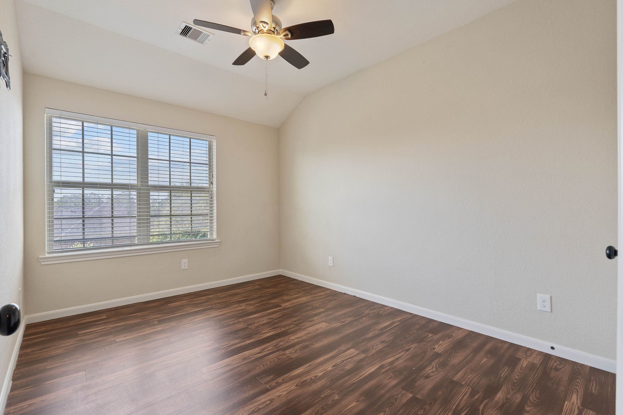 3544 Woods Estates Drive Conroe, TX 77304 - Photo 31 of 46 a view of empty room with wooden floor and fan