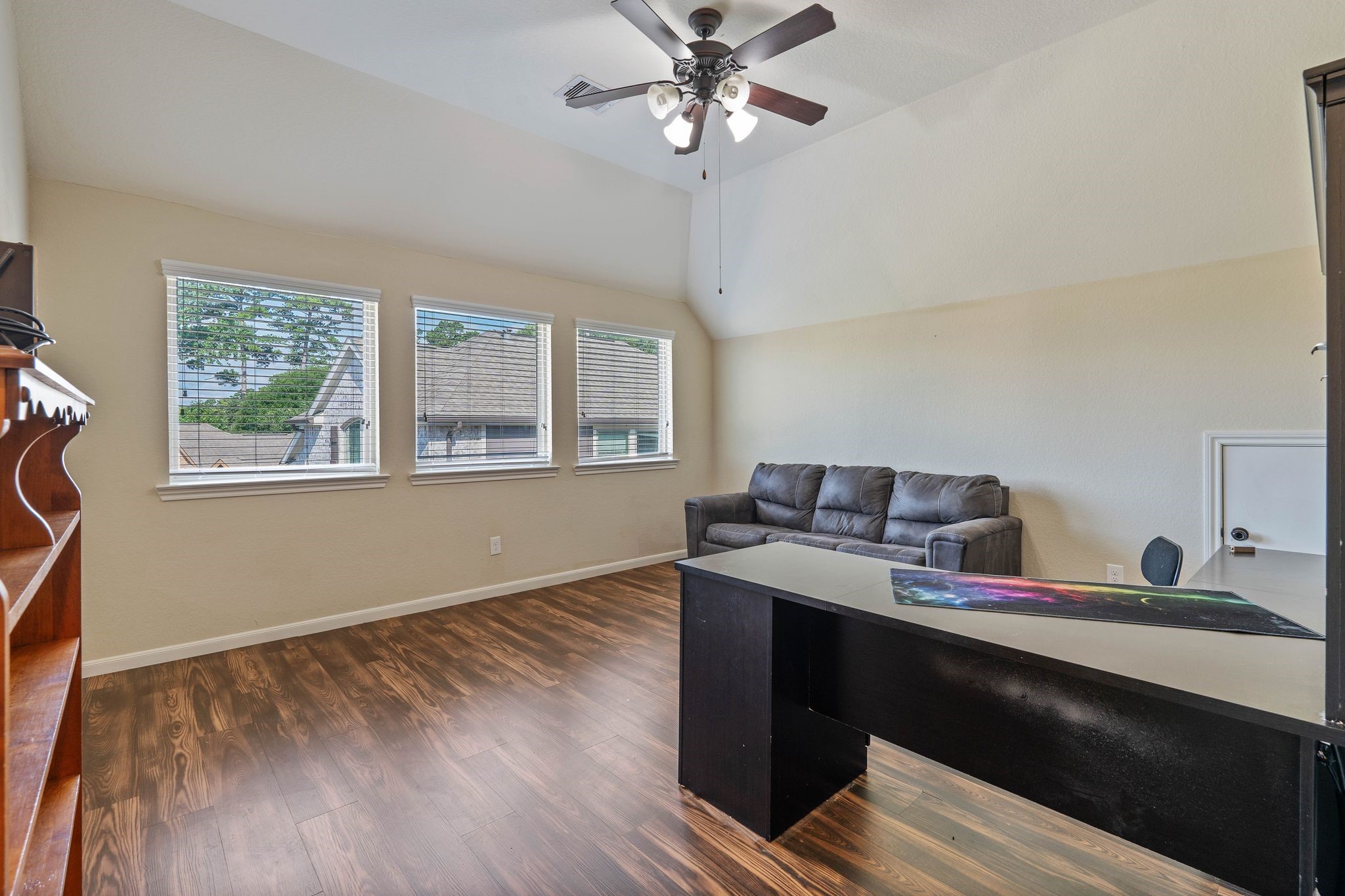 3544 Woods Estates Drive Conroe, TX 77304 - Photo 34 of 46 a view of a workspace with furniture and a window