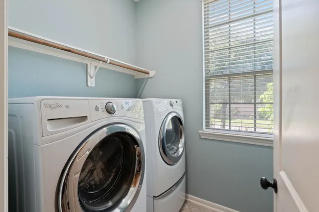 a utility room with dryer and washer