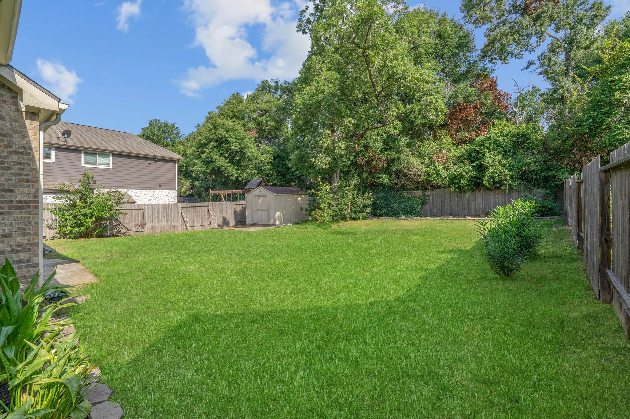 3544 Woods Estates Drive Conroe, TX 77304 - Photo 39 of 46 a view of a backyard with a garden