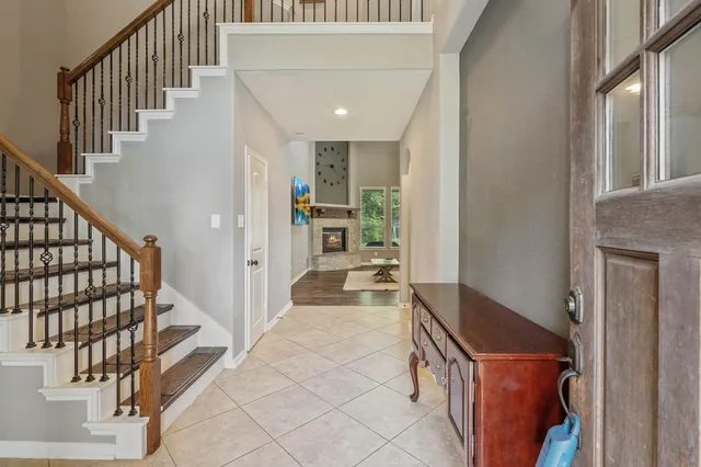 a hallway with a large cabinets and wooden floor