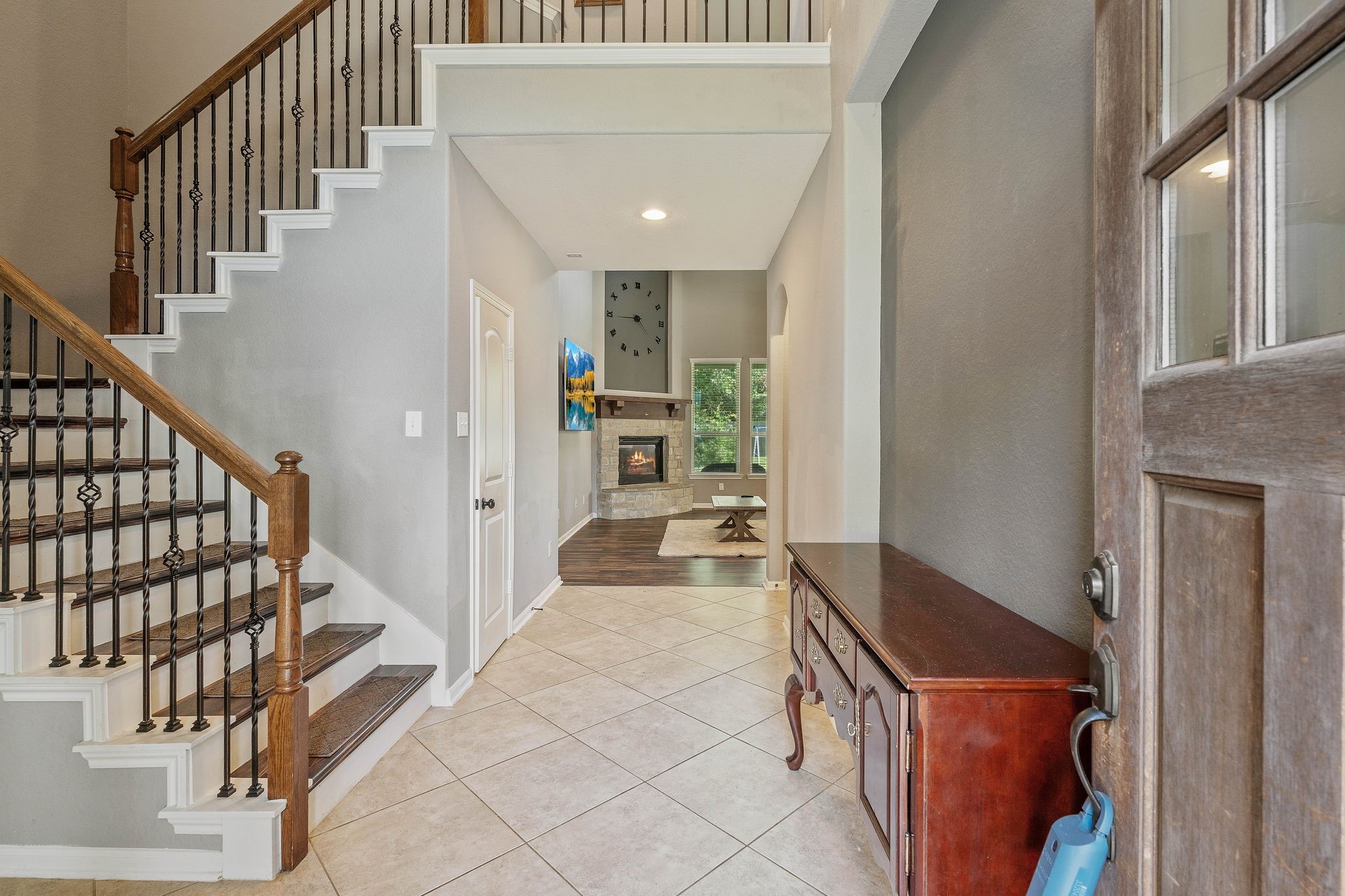 3544 Woods Estates Drive Conroe, TX 77304 - Photo 4 of 46 a hallway with a large cabinets and wooden floor