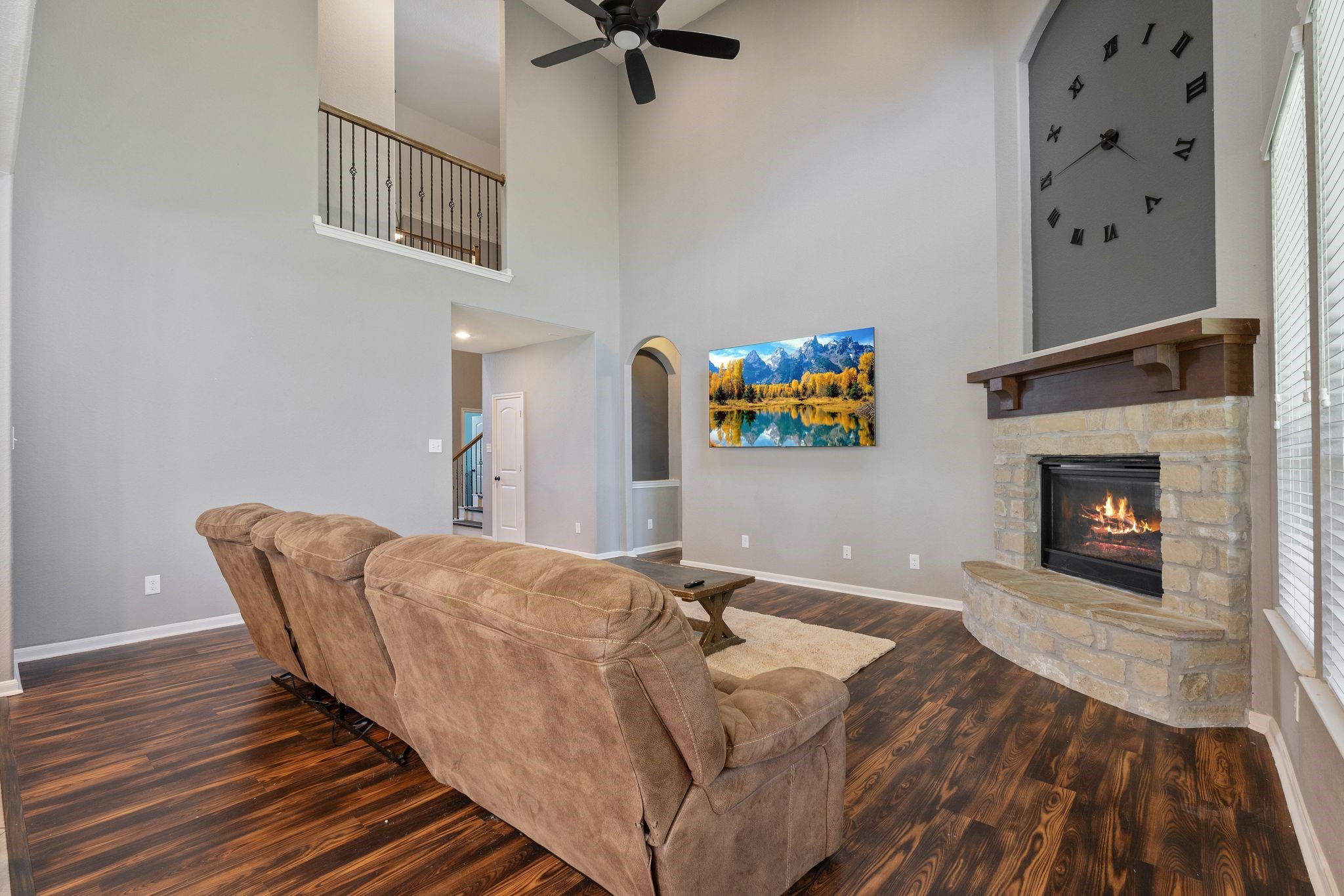 3544 Woods Estates Drive Conroe, TX 77304 - Photo 7 of 46 a living room with furniture and a fireplace