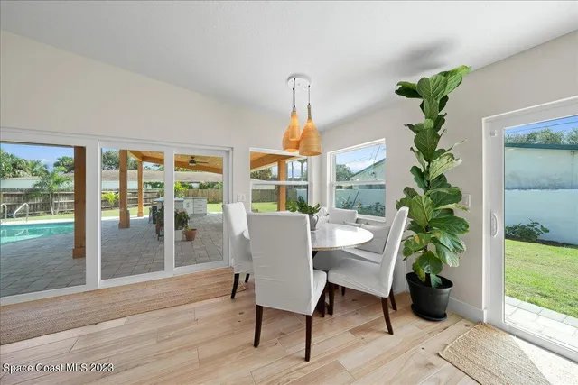 a view of a livingroom with furniture and hardwood floor