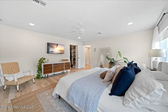 a bathroom with a granite countertop shower sink and mirror