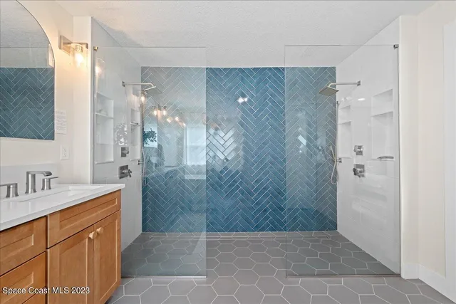 a view of walk in closet with clothes