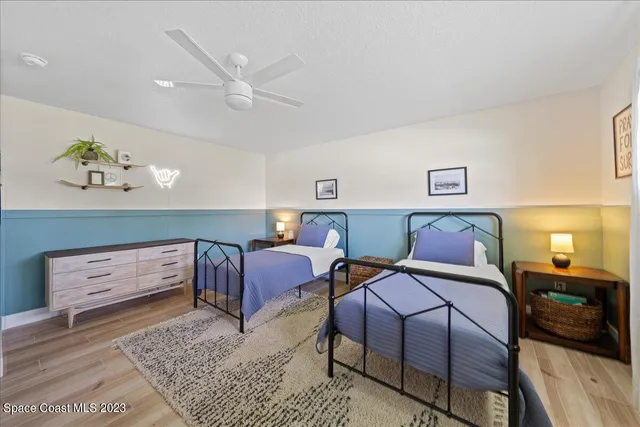 a bathroom with double vanity sink and a mirror
