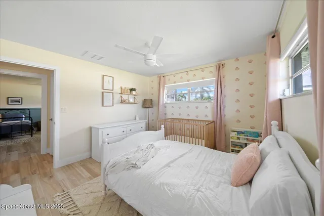 a bedroom with a bed and a table