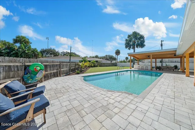 a view of a swimming pool with a patio