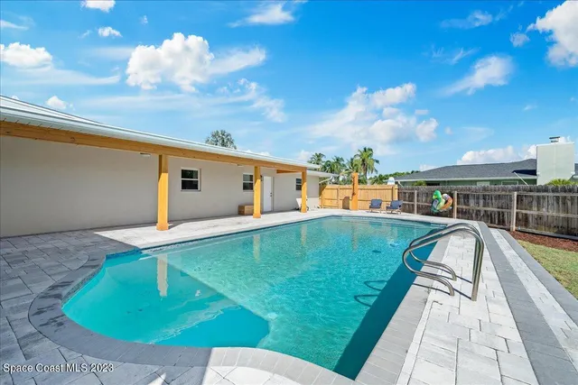 a view of house with yard