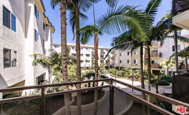 a view of multiple house with outdoor space and trees