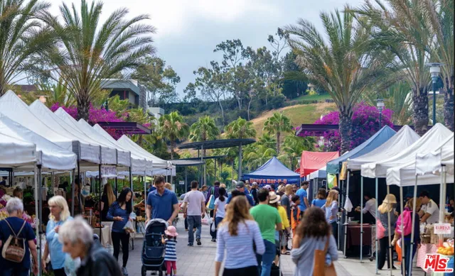 a view of people sitting in front of shop