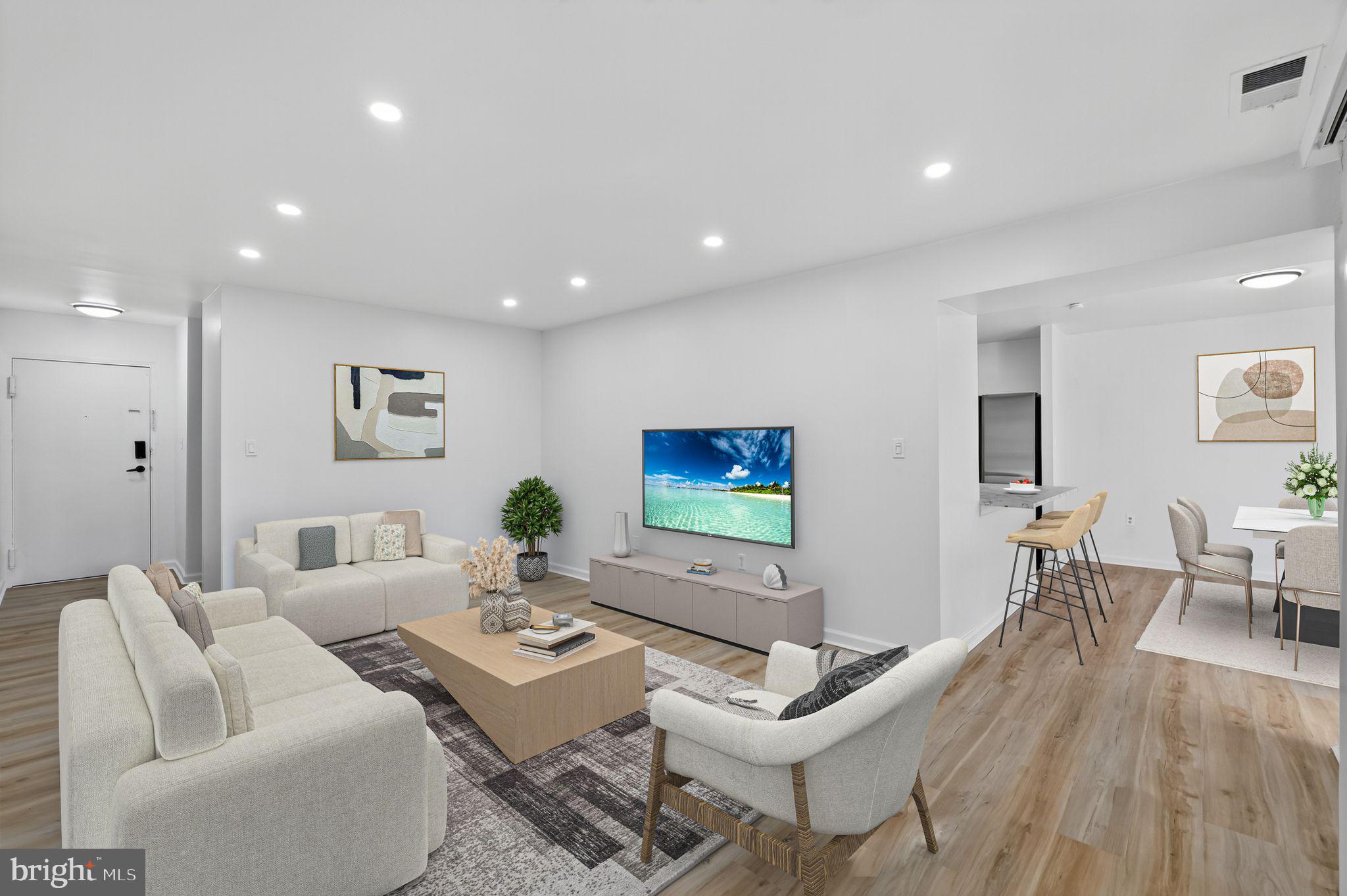 8481 Greenbelt Road, Unit 201 Greenbelt, MD 20770 - Photo 1 of 26 a living room with furniture a rug and a flat screen tv
