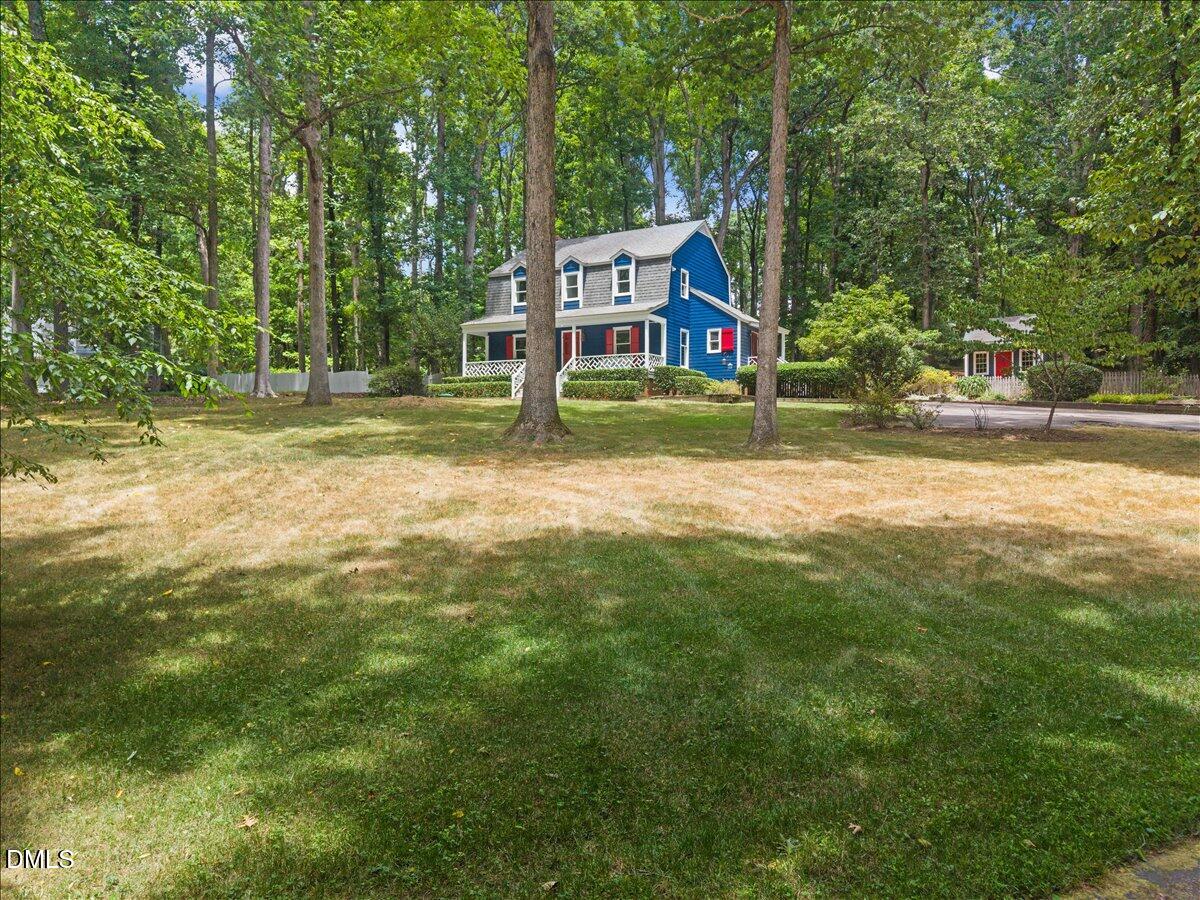 6516 Bakersfield Drive Raleigh, NC 27606 - Photo 53 of 59 a view of a house with a yard