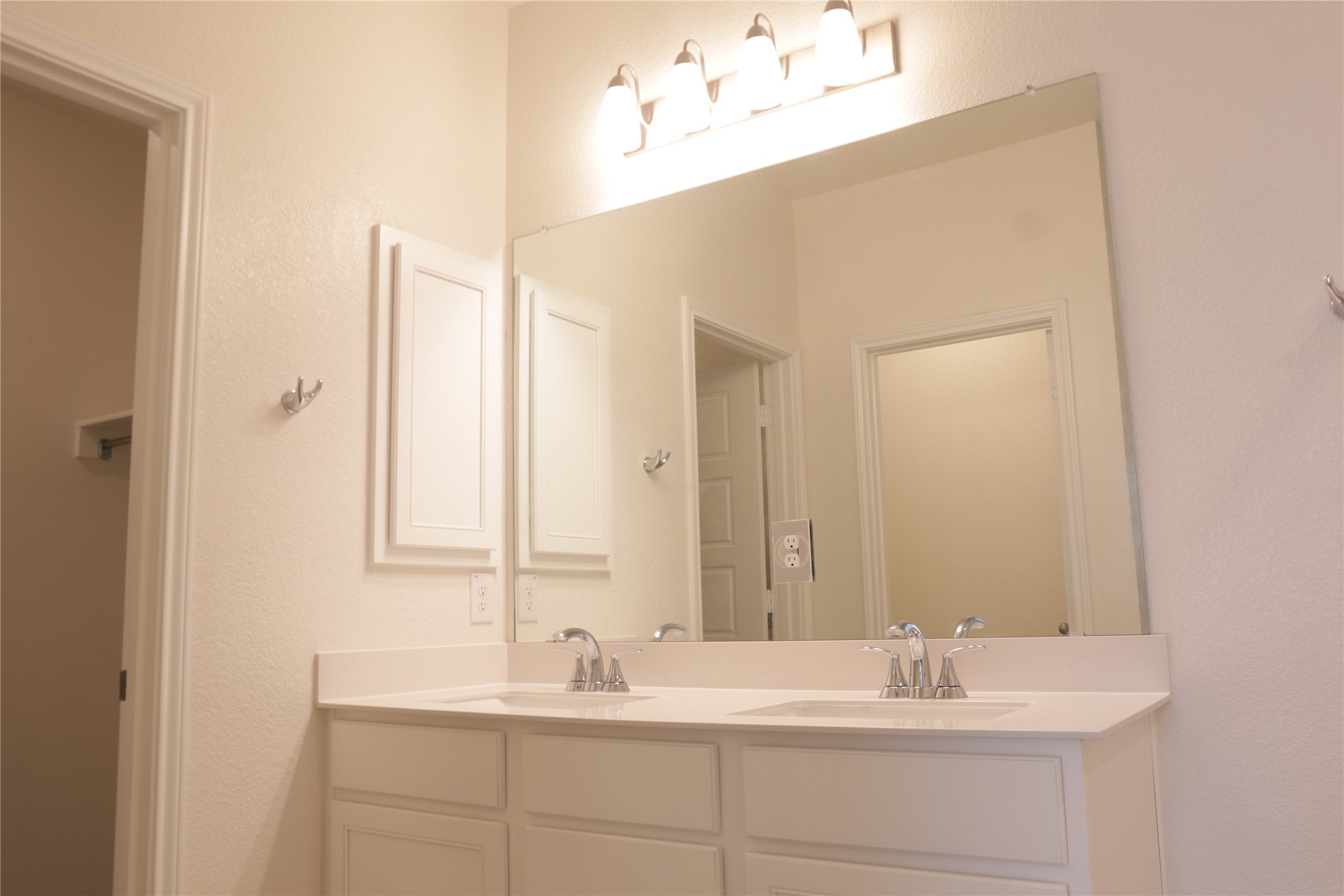 8111 Marigny Way Austin, TX 78744 - Photo 25 of 29 Double vanity with ample counter space creates a functional and pleasing bath area.