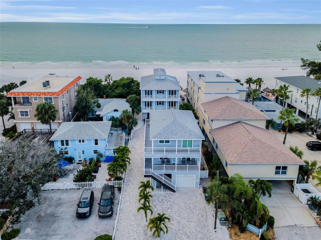 204 Gulf Boulevard Indian Rocks Beach, FL 33785 - Photo 1 of 72 an aerial view of multiple houses with a swimming pool