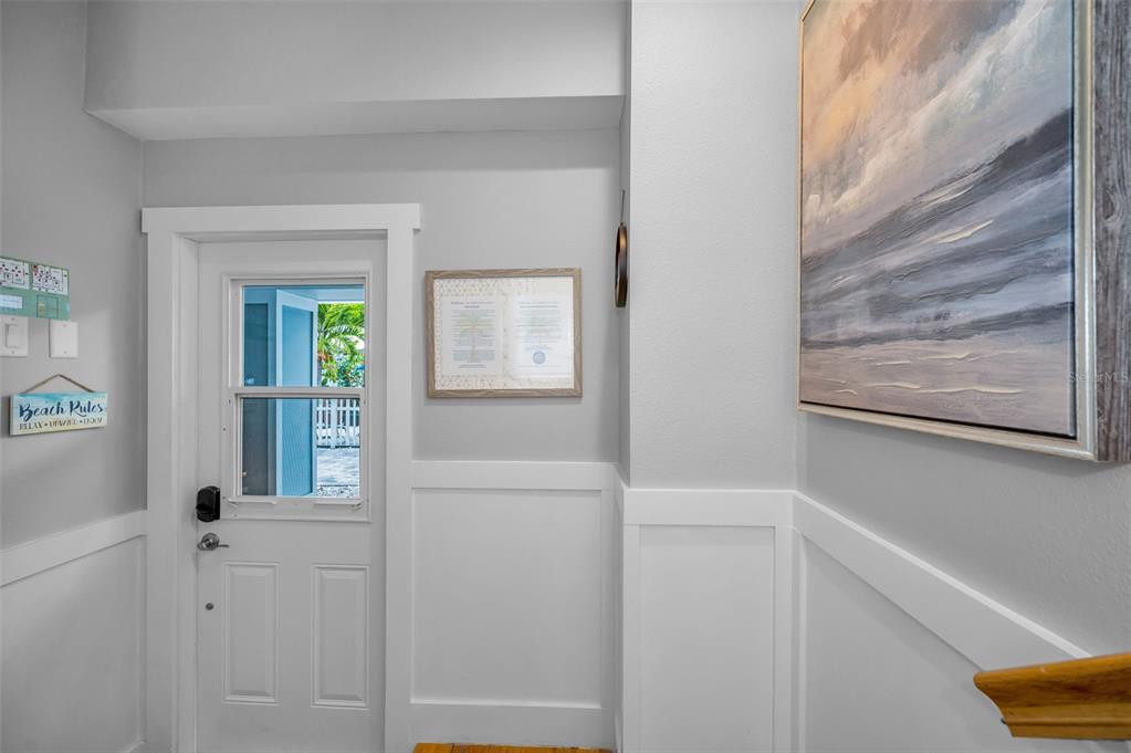 204 Gulf Boulevard Indian Rocks Beach, FL 33785 - Photo 14 of 72 a view of a hallway with front door