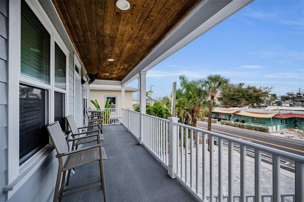 204 Gulf Boulevard Indian Rocks Beach, FL 33785 - Photo 20 of 72 a view of a porch with furniture