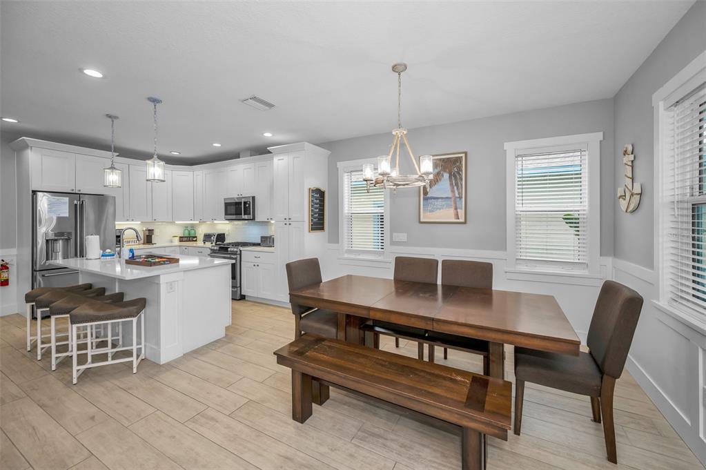 204 Gulf Boulevard Indian Rocks Beach, FL 33785 - Photo 26 of 72 a kitchen with a table and chairs