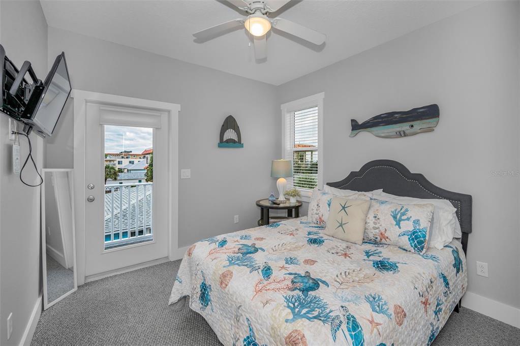 204 Gulf Boulevard Indian Rocks Beach, FL 33785 - Photo 51 of 72 a bedroom with a bed and window