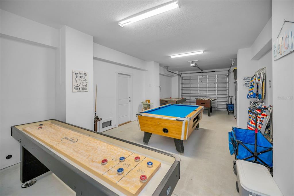 204 Gulf Boulevard Indian Rocks Beach, FL 33785 - Photo 57 of 72 a room with furniture and a table