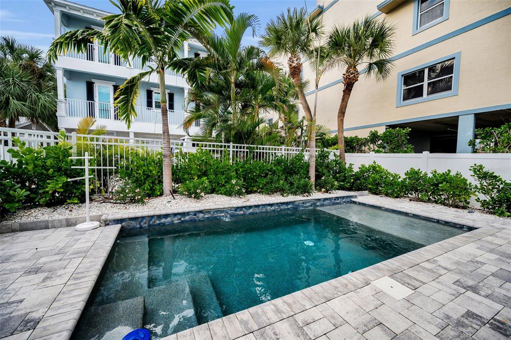 204 Gulf Boulevard Indian Rocks Beach, FL 33785 - Photo 61 of 72 a view of a house with a swimming pool