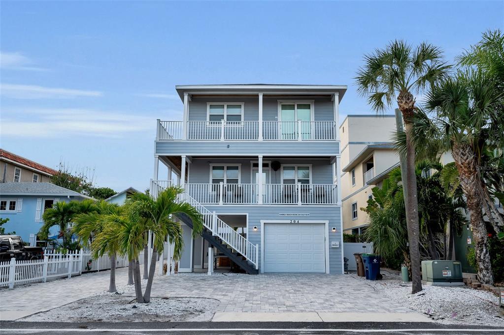 204 Gulf Boulevard Indian Rocks Beach, FL 33785 - Photo 8 of 72 a front view of house with yard