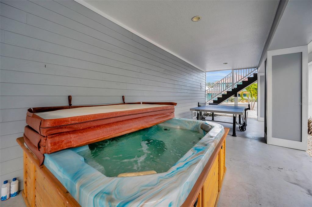 204 Gulf Boulevard Indian Rocks Beach, FL 33785 - Photo 9 of 72 a backyard of a house with seating space