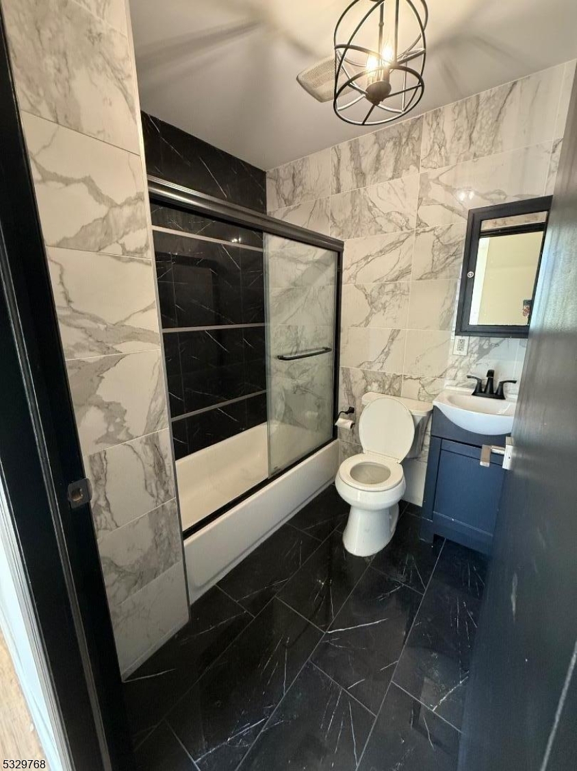 182 Ferry Street, Unit 2B Newark, NJ 07105 - Photo 12 of 16 a bathroom with a toilet and a shower