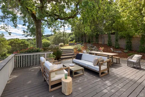 a outdoor living space with furniture and wooden floor