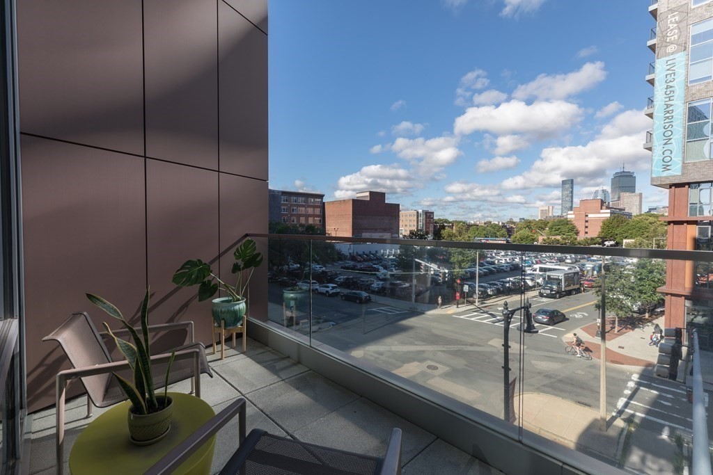 32 Traveler Street, Unit 304 Boston, MA 02118 - Photo 12 of 35 a view of a balcony with potted plants
