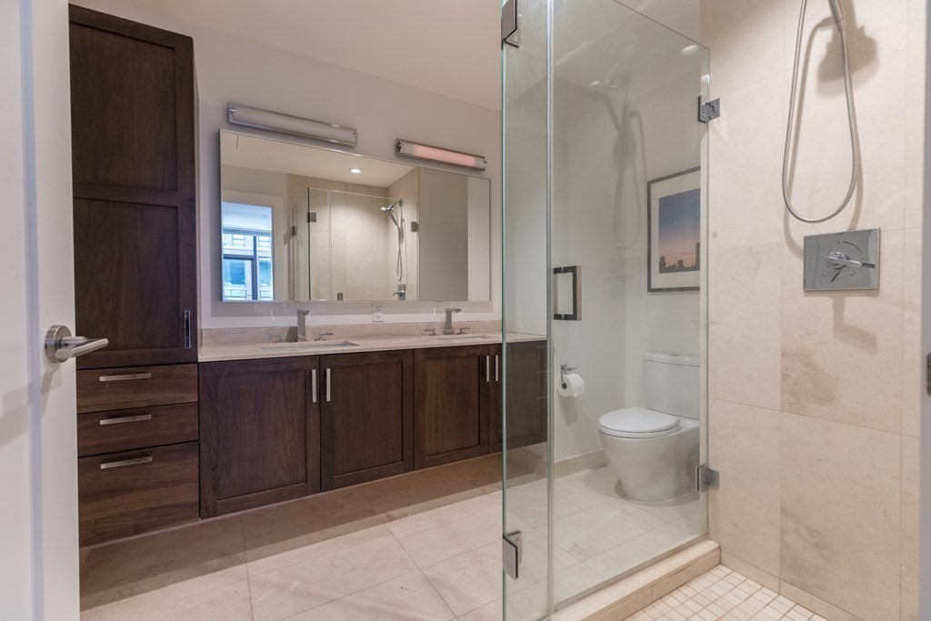 32 Traveler Street, Unit 304 Boston, MA 02118 - Photo 18 of 35 a bathroom with a sink a toilet and shower