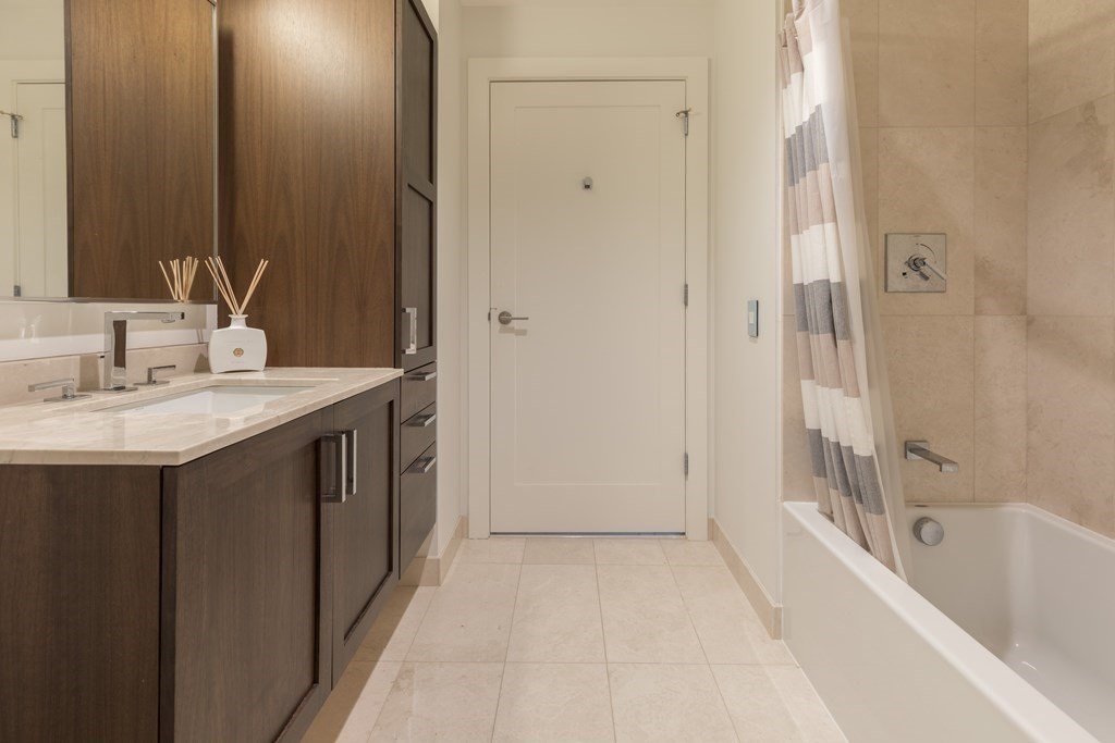 32 Traveler Street, Unit 304 Boston, MA 02118 - Photo 21 of 35 a bathroom with a sink and a bathtub