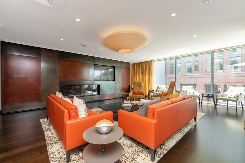 32 Traveler Street, Unit 304 Boston, MA 02118 - Photo 27 of 35 a living room with furniture and a flat screen tv