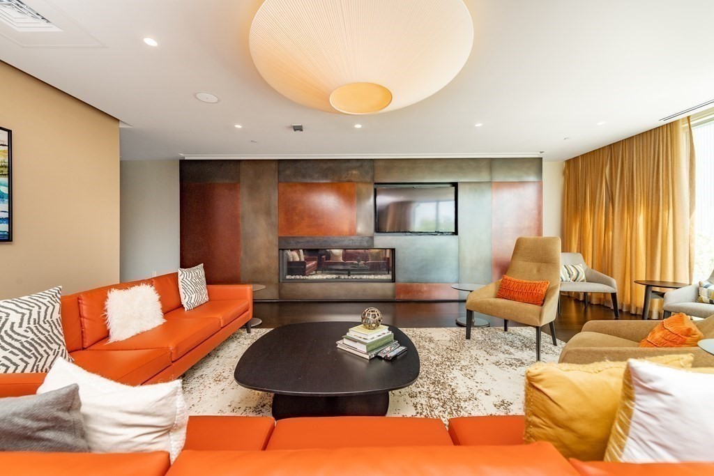 32 Traveler Street, Unit 304 Boston, MA 02118 - Photo 28 of 35 a living room with furniture and a large window