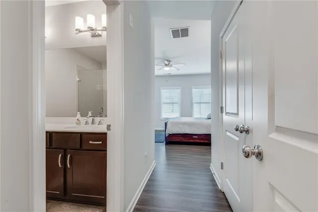 a en suite bathroom with a sink and mirror