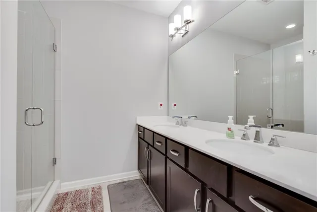 a bathroom with a double vanity sink a and mirror