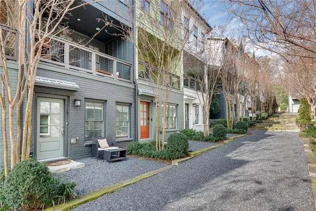 a view of a building with a bench in front of building