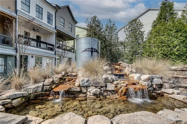a view of a water pond with lots of trees