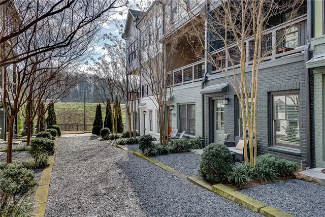 a front view of a building with a yard