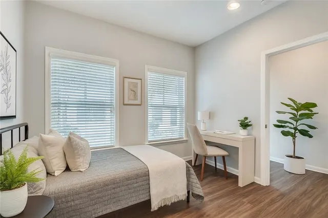 a bedroom with a bed and a table