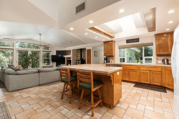a kitchen with cabinets appliances and a sink