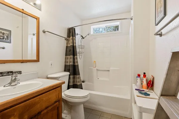 a view of a house with a tree