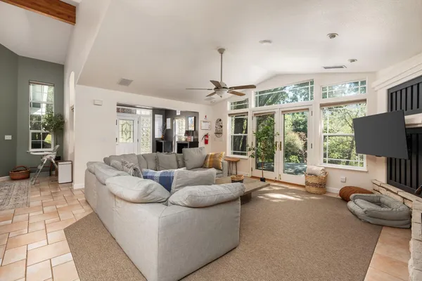 a dining room with furniture and a flat screen tv