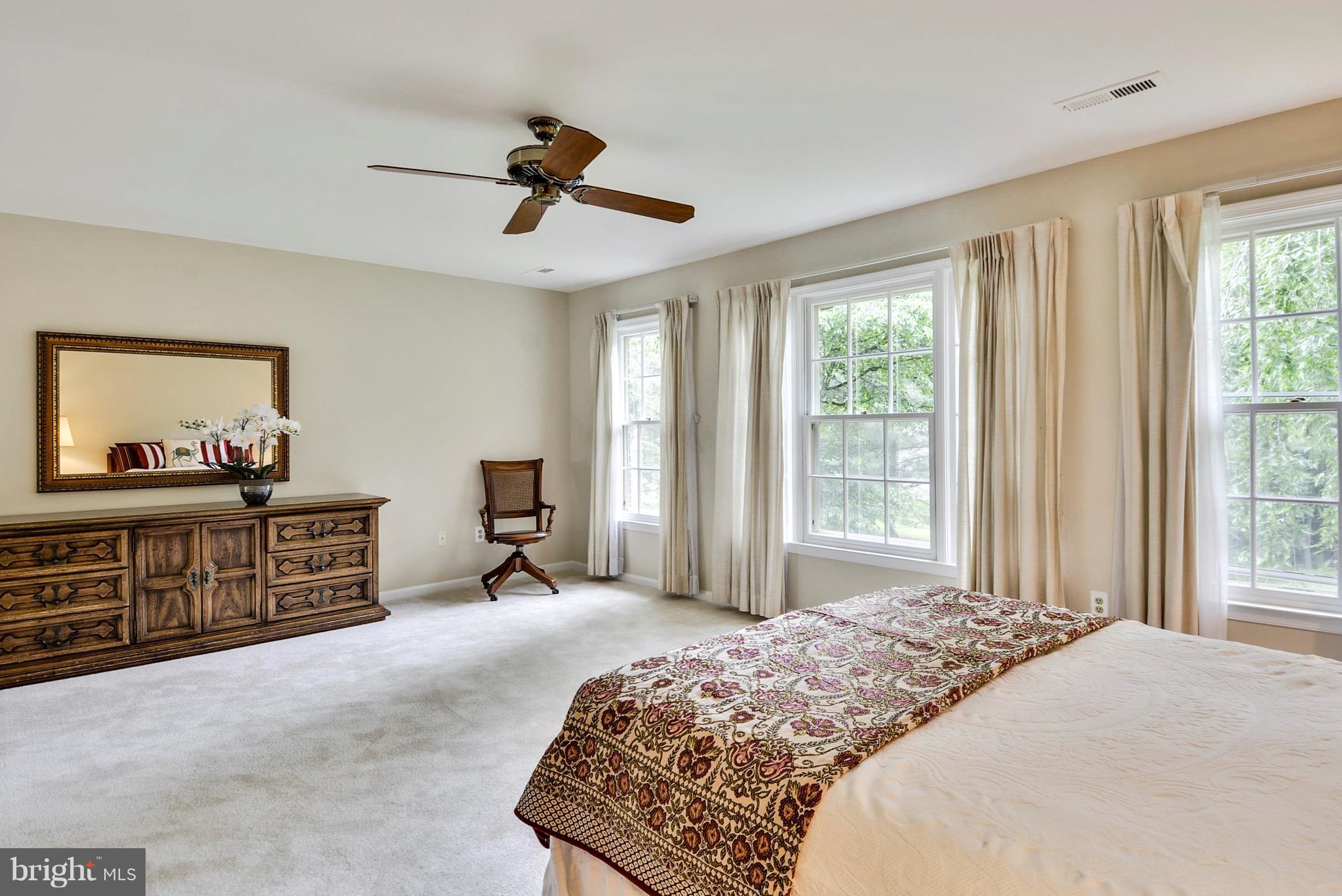 6505 Deidre Terrace McLean, VA 22101 - Photo 14 of 30 a bedroom with a bed and large windows