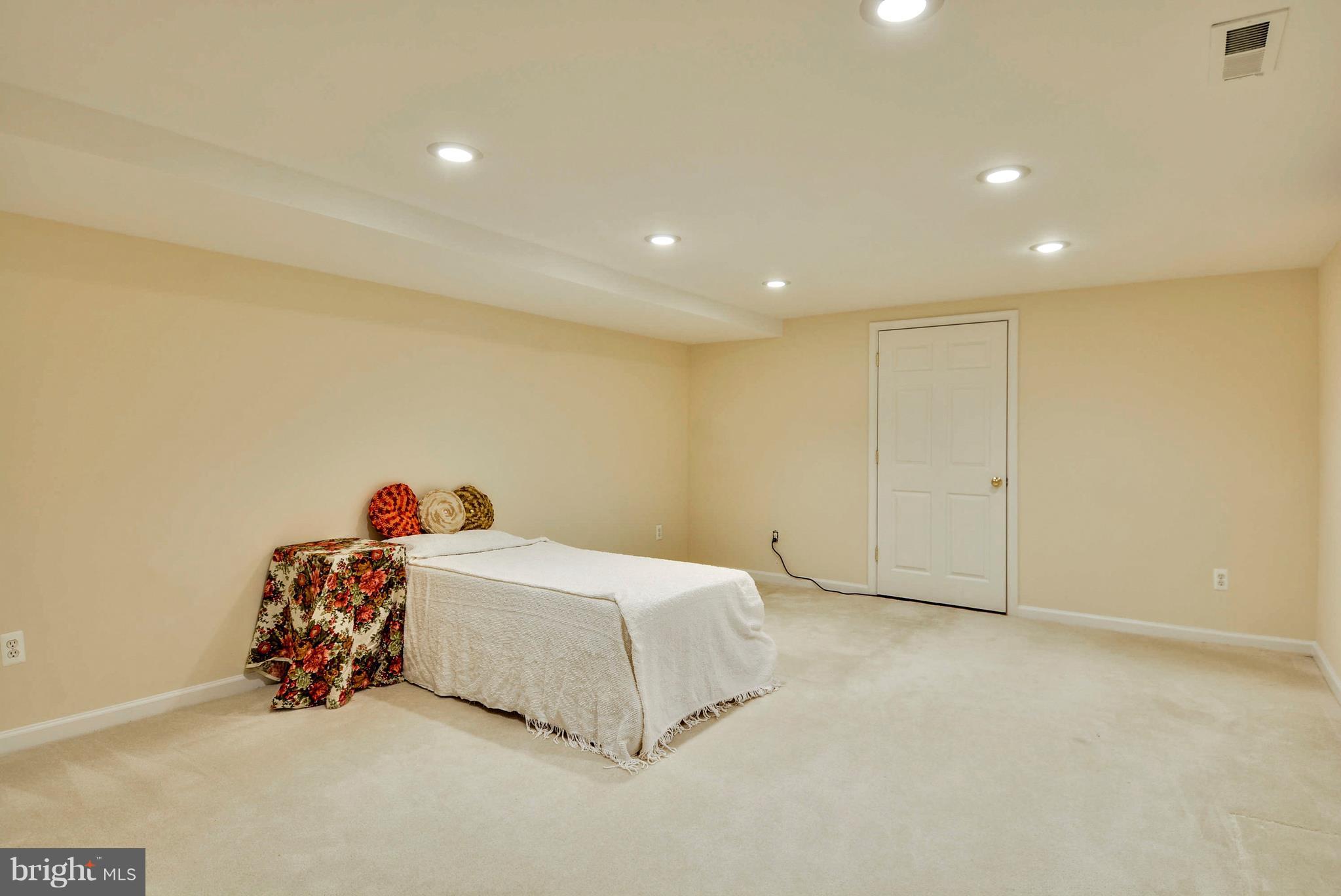 6505 Deidre Terrace McLean, VA 22101 - Photo 25 of 30 a spacious bedroom with a bed and a window