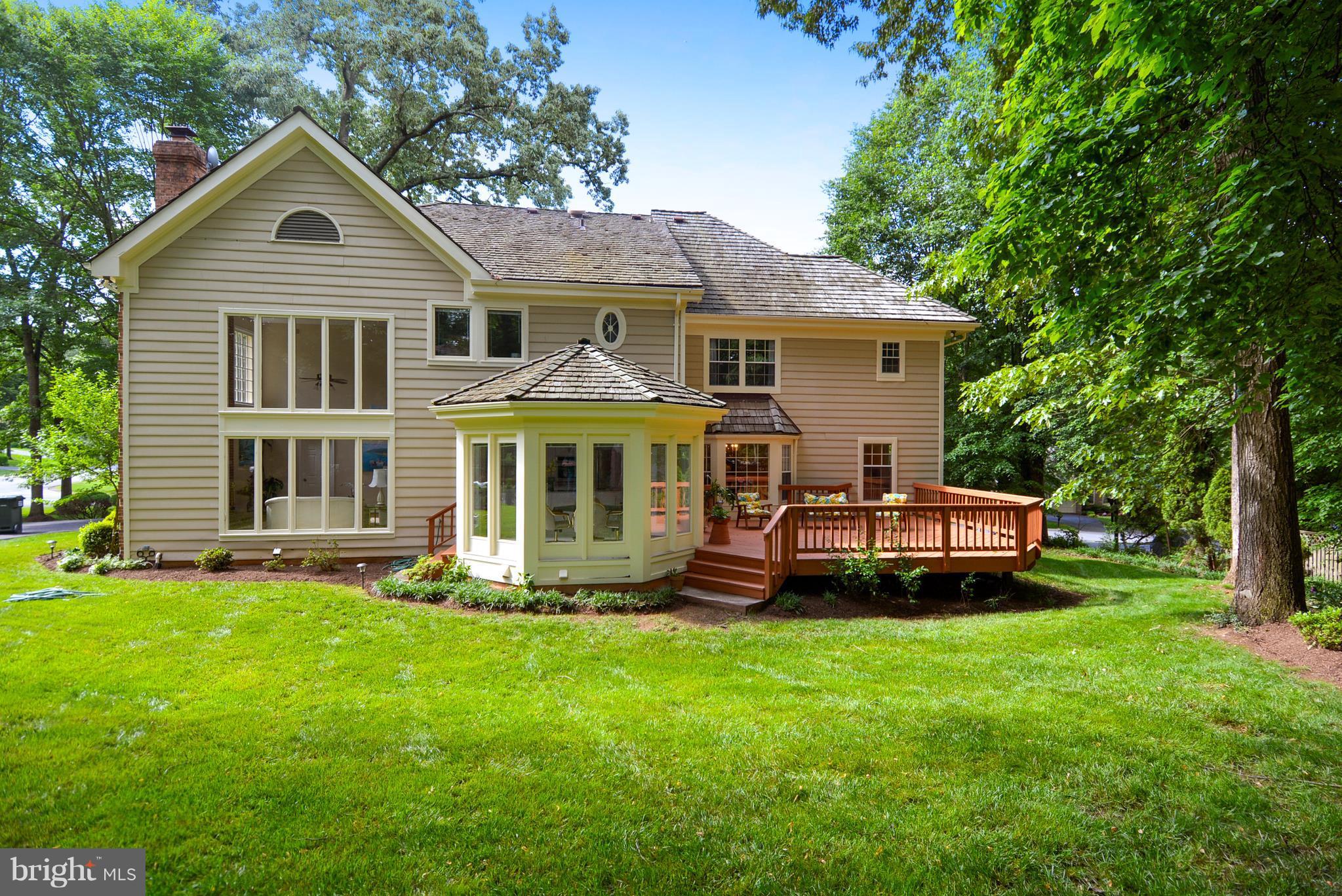 6505 Deidre Terrace McLean, VA 22101 - Photo 30 of 30 a front view of a house with a garden and trees