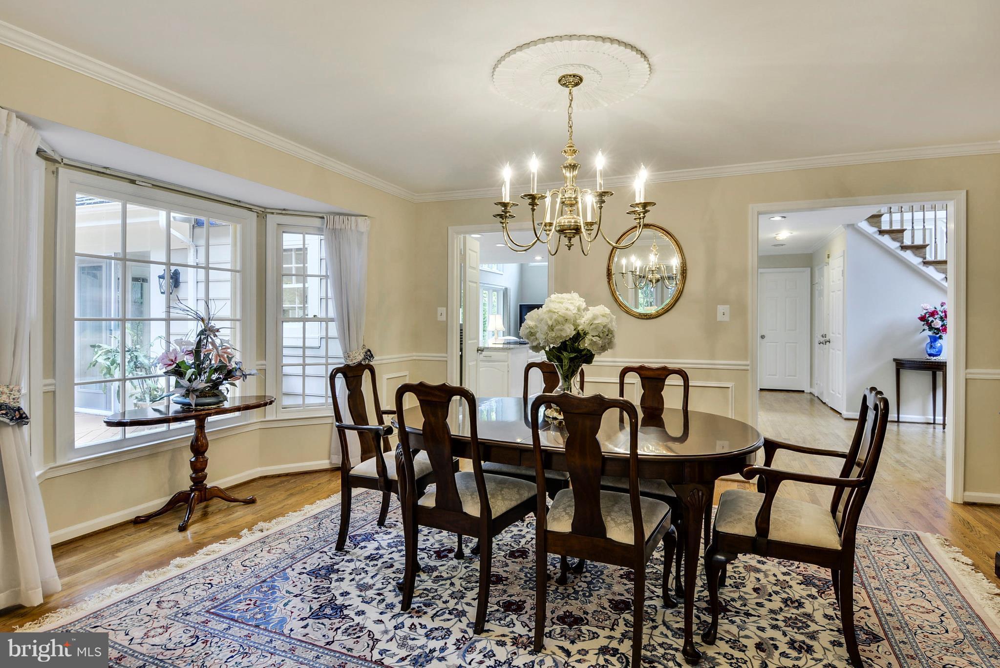 6505 Deidre Terrace McLean, VA 22101 - Photo 5 of 30 a view of a dining room that has a table and chairs