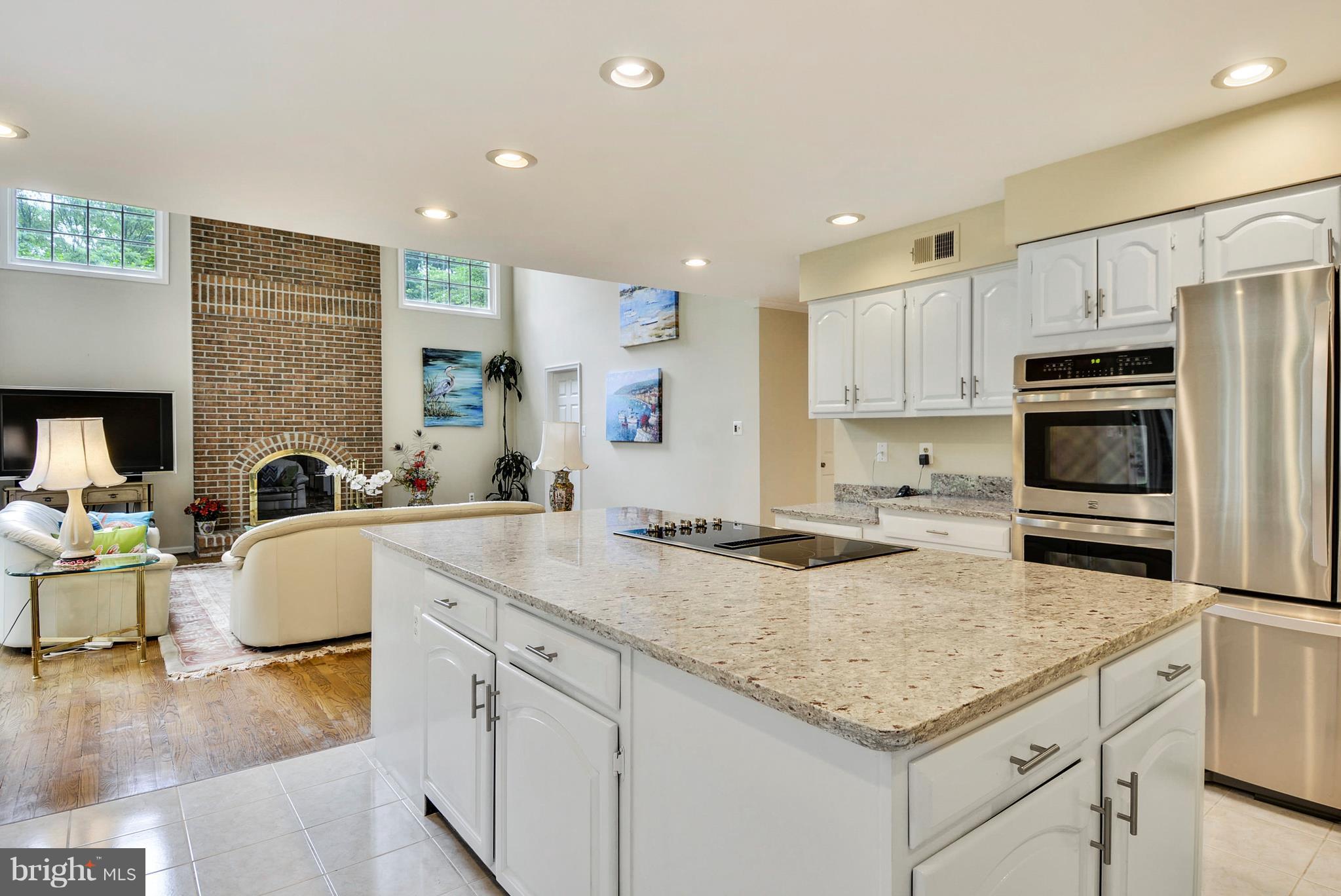 6505 Deidre Terrace McLean, VA 22101 - Photo 9 of 30 a kitchen with stainless steel appliances granite countertop a sink and cabinets