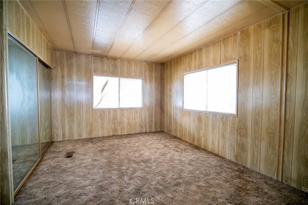 1439 Ridgemont Way Corona, CA 92882 - Photo 10 of 17 an empty room with windows
